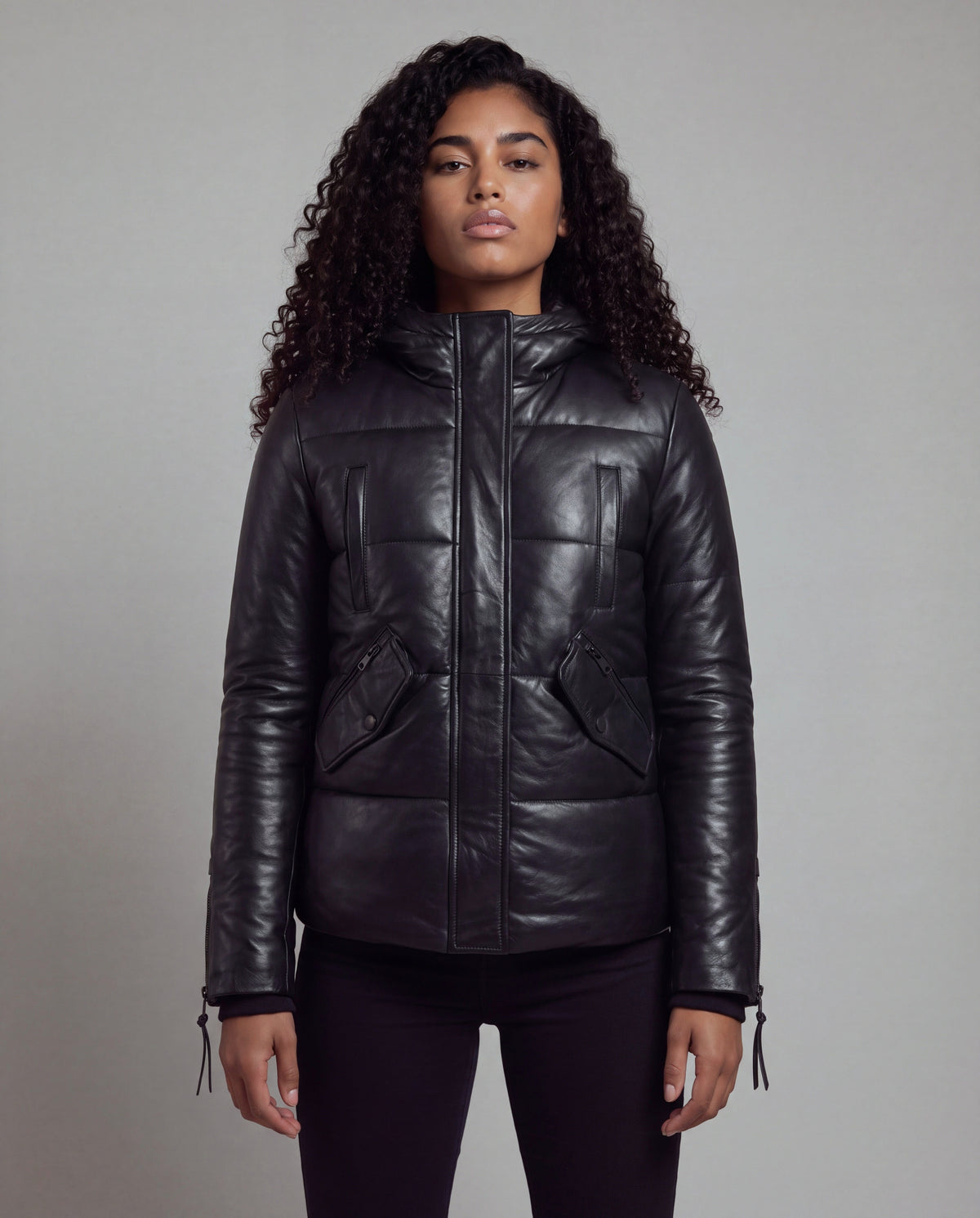 Cocoon by tigha – women's puffer leather jacket with hood in sheepskin, Heavy Washed Black, front view on model