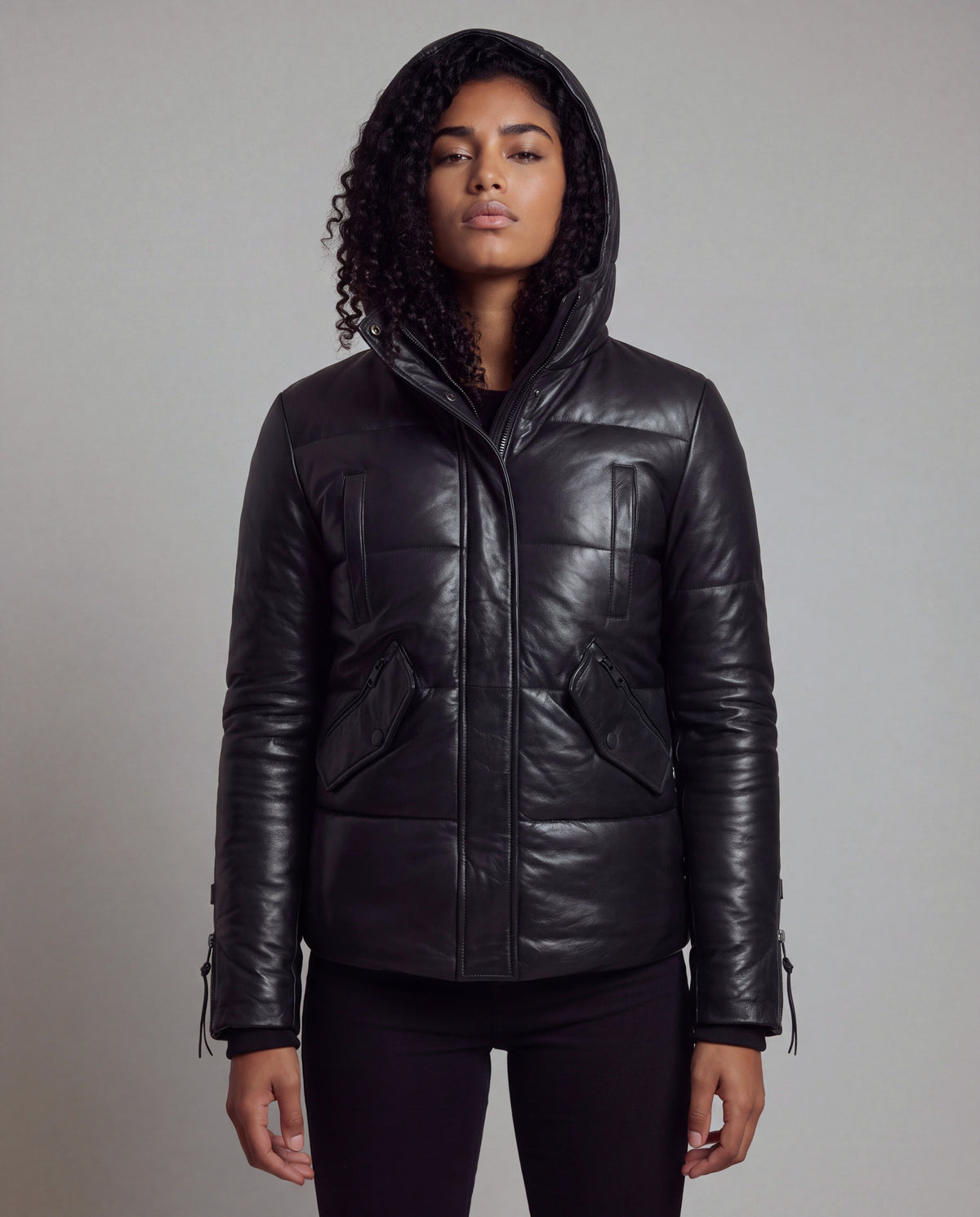 Cocoon by tigha – women's puffer leather jacket with hood in sheepskin, Heavy Washed Black, front view, looking down