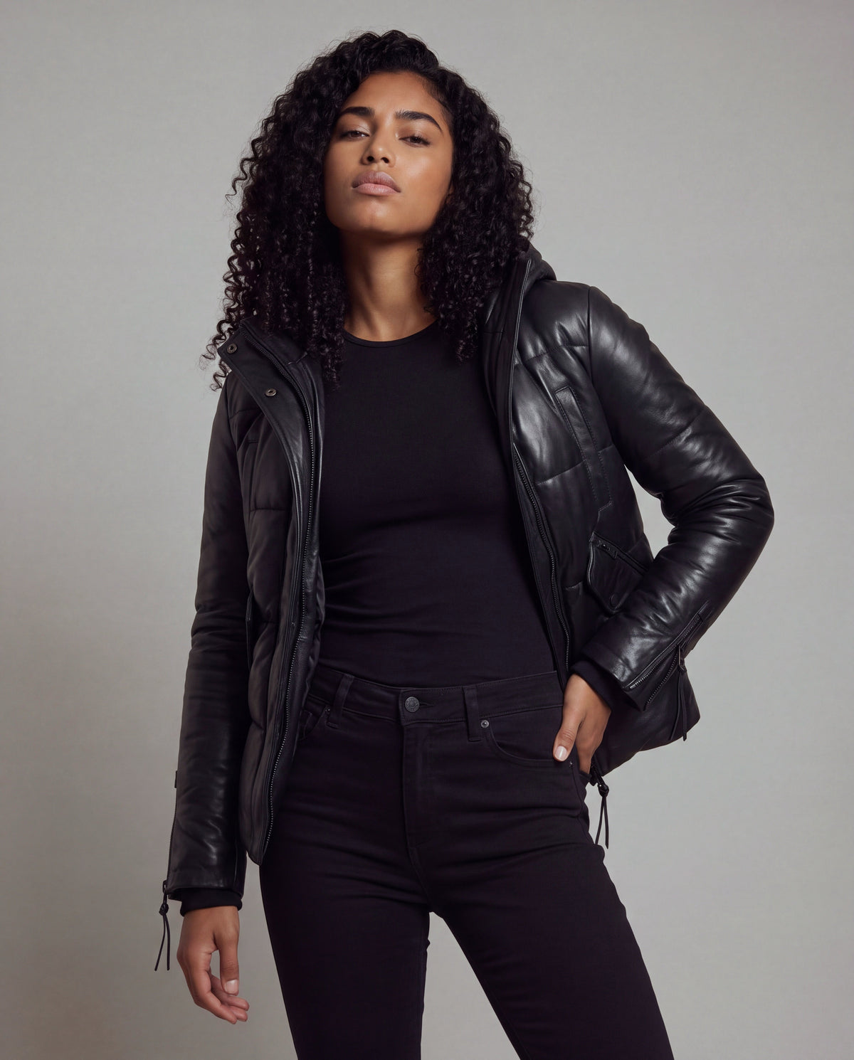 Cocoon by tigha – women's puffer leather jacket with hood in sheepskin, Heavy Washed Black, front view, worn open